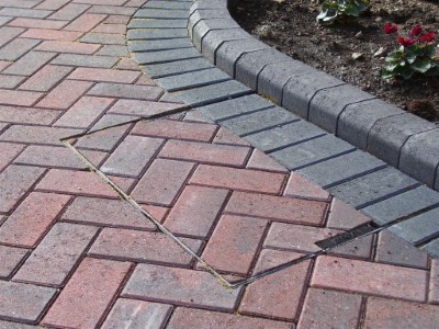 Brindle driveway with recessed cover and raised block key kerbs