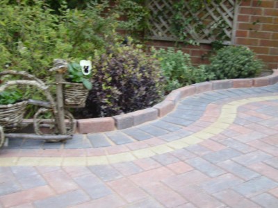 Driveway with raised brick edge on a S shaped curve