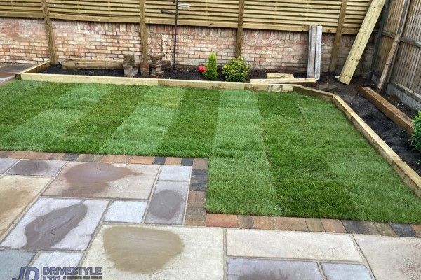 Sandstone Patio with Brick Border, Sleepers and Roll-On Turf in Faversham (6)