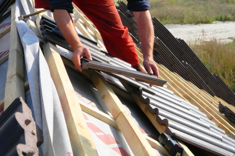Roofing,Construction,With,Clay,Roof,Tiles.,Roofer,Laying,Ceramic,Roof Roofing,Construction,With,Clay,Roof,Tiles.,Roofer,Laying,Ceramic,Roof